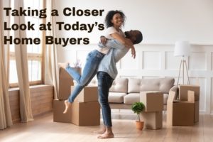 black couple embrace in room with moving boxes